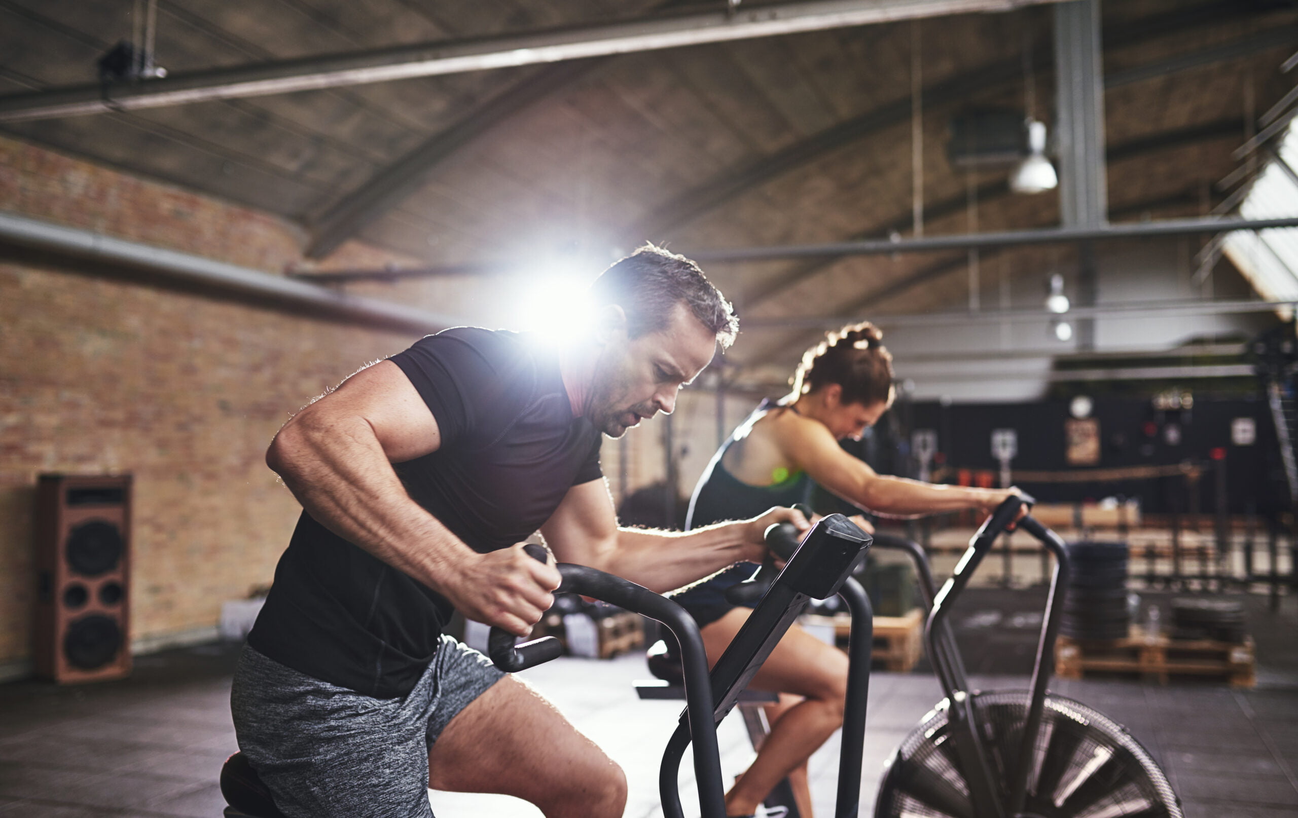 sportsmen-working-out-hard-on-cycling-machines-2021-08-26-17-26-42-utc-scaled.jpg